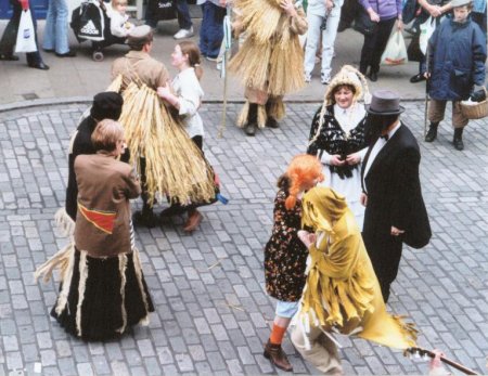 Aughakillymaude Community Mummers: Dancing, Big Head and Little Wit (without hat) with Beelzebub.